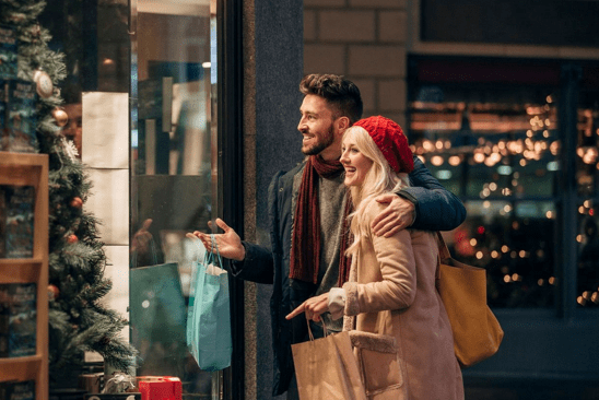 Couple Smiling Outside Store window